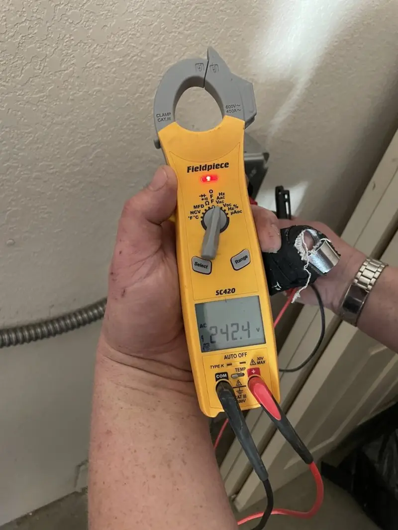 Voltage testing with clamp meter during Hot Tub / Pool Electrical Wiring in Rockwell